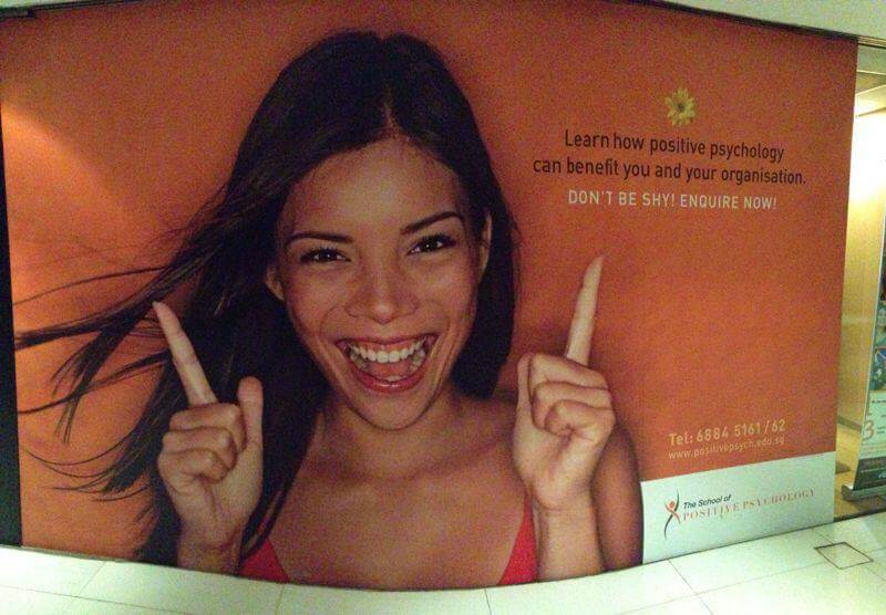 Advertisement Featuring a Happy Woman Smiling Big While Pointing Up