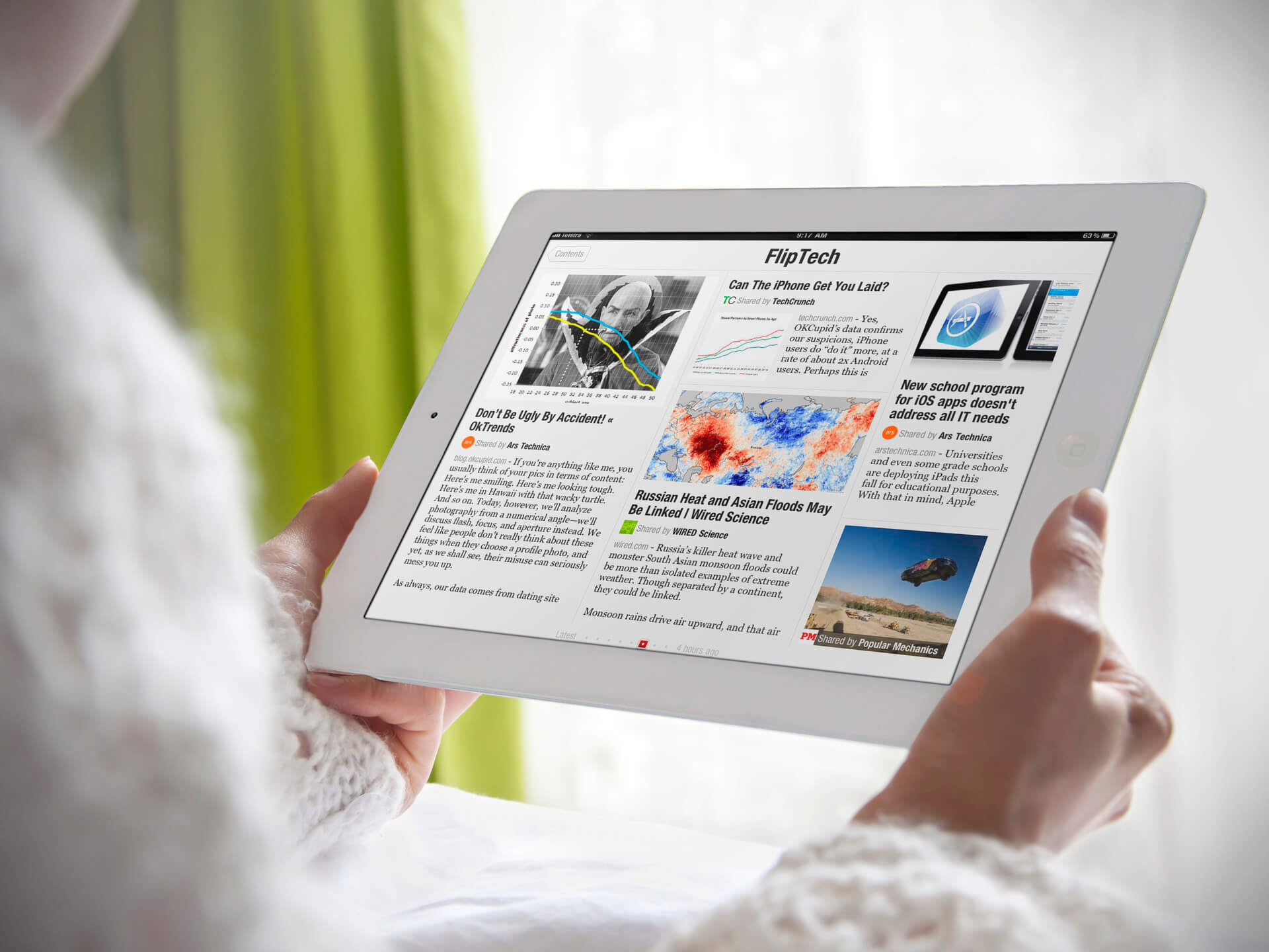 White iPad Mockup Held By a Woman in a Bedroom