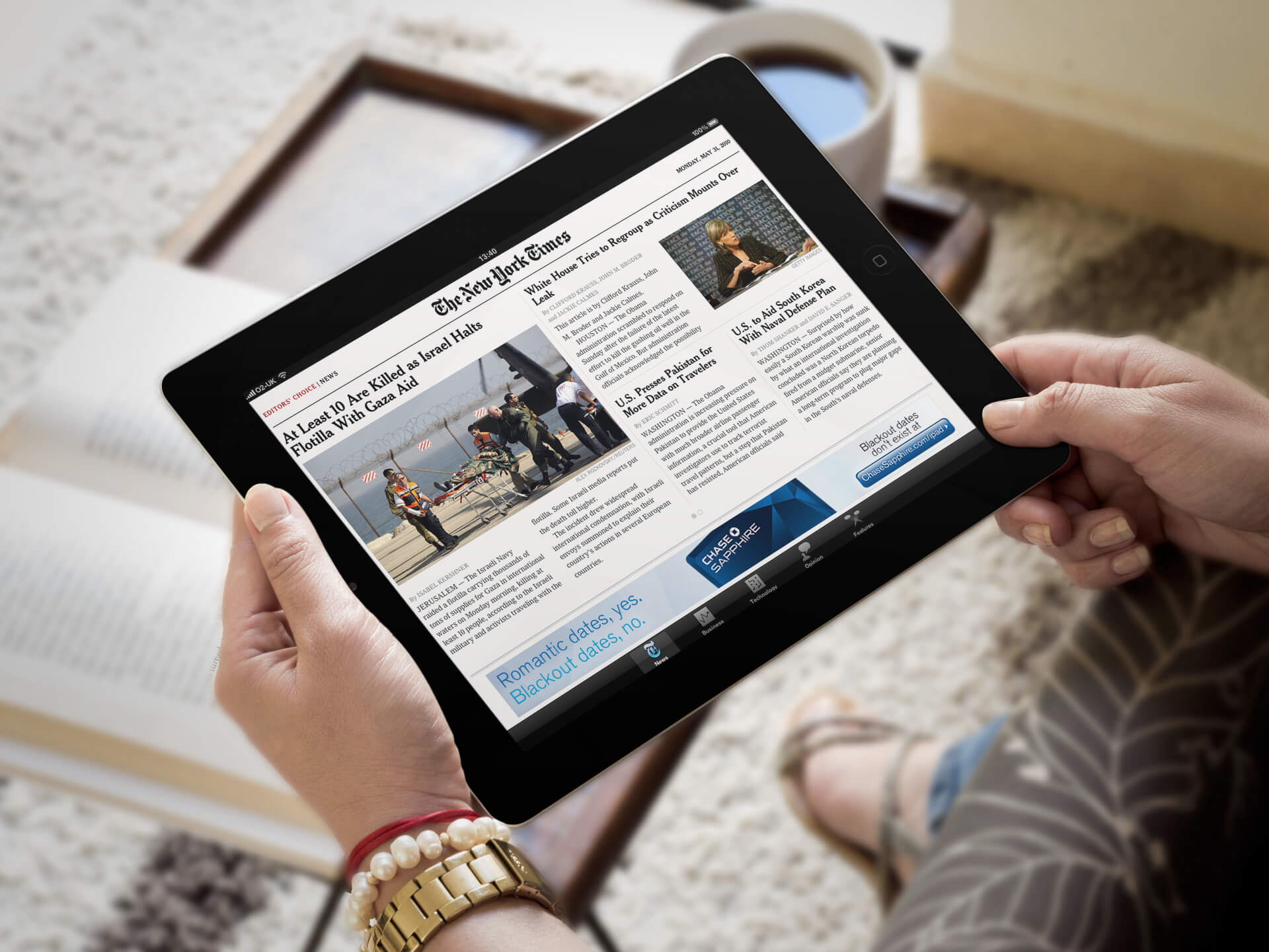 Black iPad Mockup Held By a Woman in a Living Room