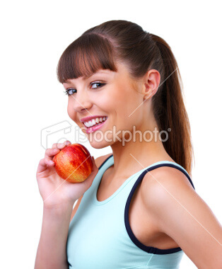 close up of a beautiful young woman eating red apple