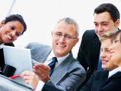 Stock Photo of a Group of Business Executives Looking at a Document