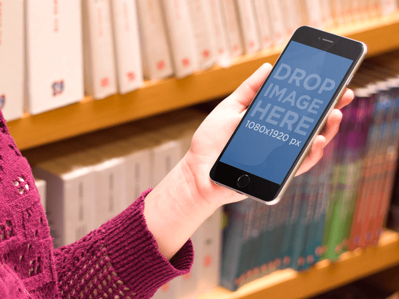 iPhone 6 Plus Mockup of Girl Using iPhone 6 Plus at the Library