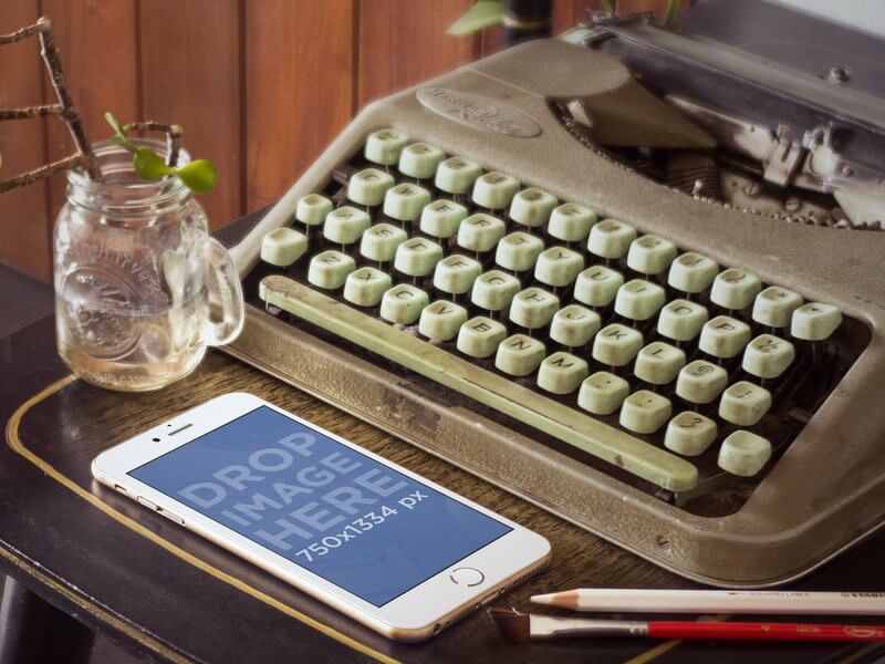 Gold iPhone 6 Mockup Next to Vintage Typewriter