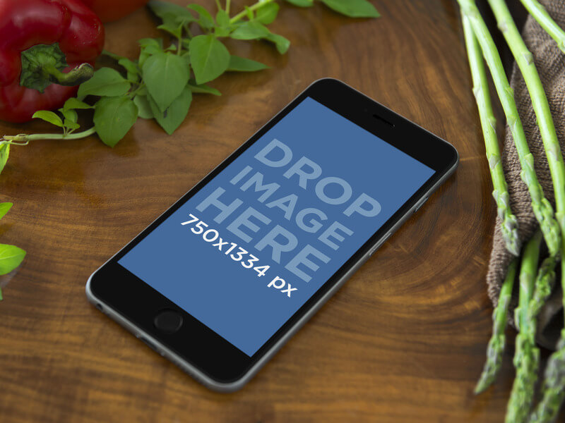 Mockup Template of iPhone 6 on Cooking Table with Vegetable