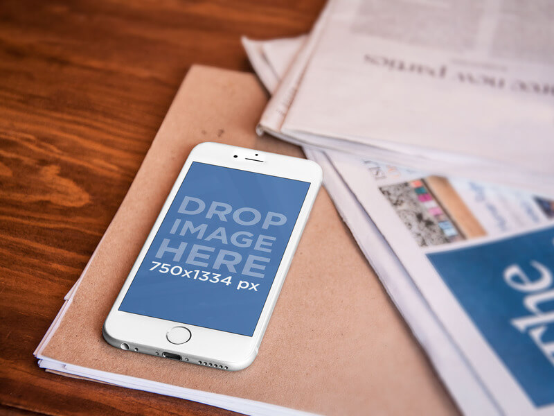 Mockup of a White iPhone 6 on an Office Desk