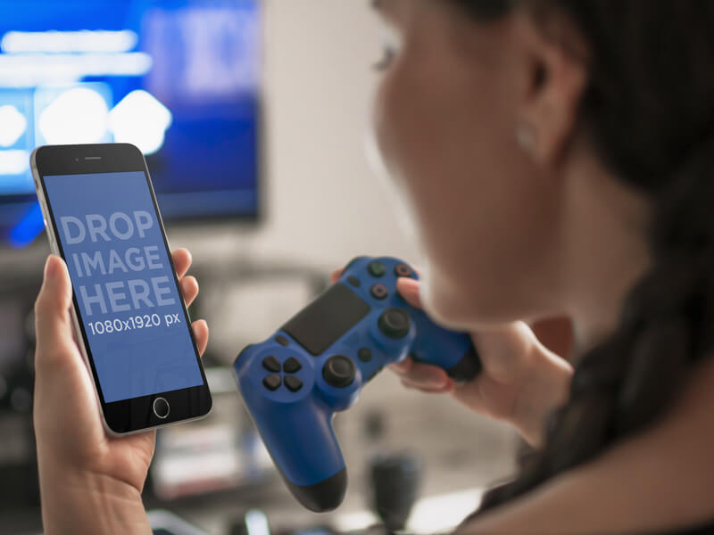 Woman Playing PlayStation 4 While Looking at iPhone 6 Mockup Template