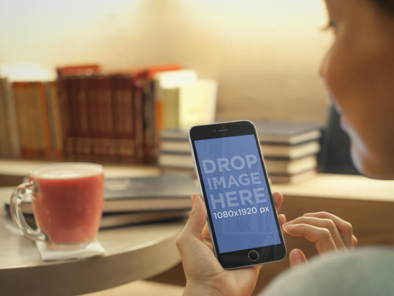 iPhone 6 Mockup Featuring a Young Woman Enjoying Tea