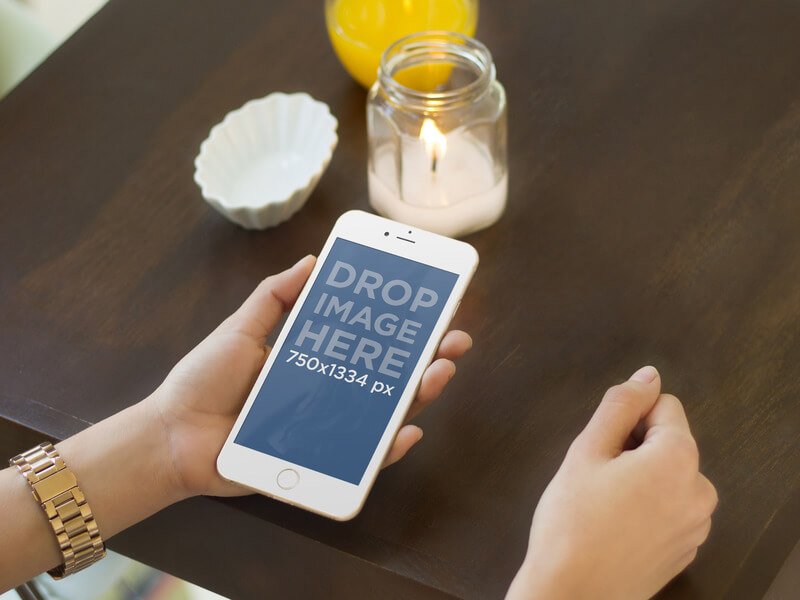 iPhone 6 Mockup of Women Using Gold iPhone 6 at Dinner Table