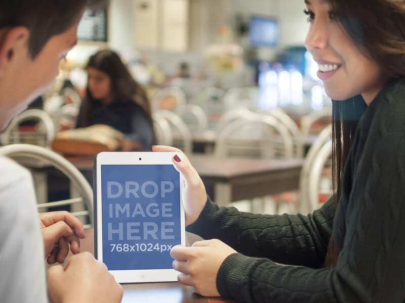 White iPad Mockup of Two Teenagers at School Cafeteria