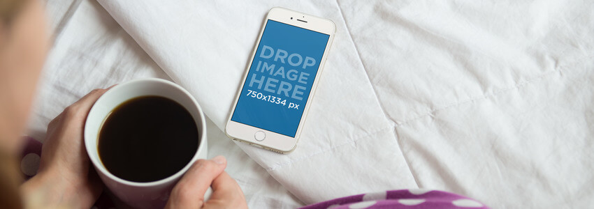 iPhone 6 Mockup of a Girl Sitting Cross-Legged in her Bed