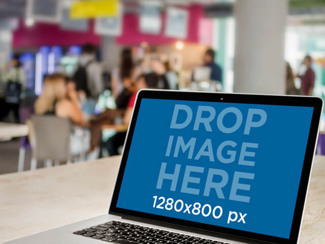 Macbook Mockup Template in a Crowded Cafeteria