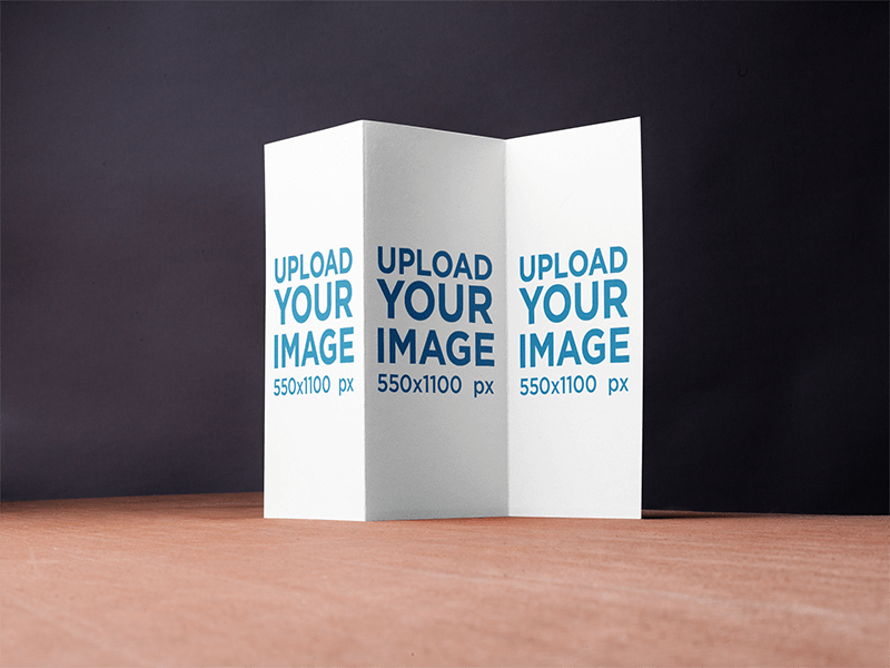 Brochure Mockup Standing Over A Wooden Surface