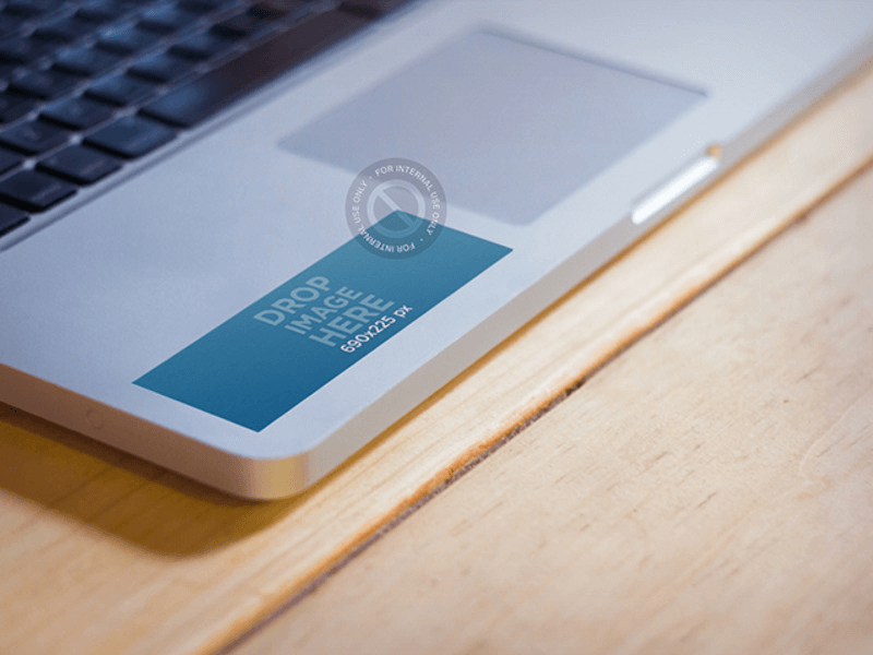 mockup of a sticker on a macbook