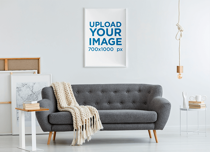 Mockup Of A Vertical Art Print Placed Over A Modern Sofa