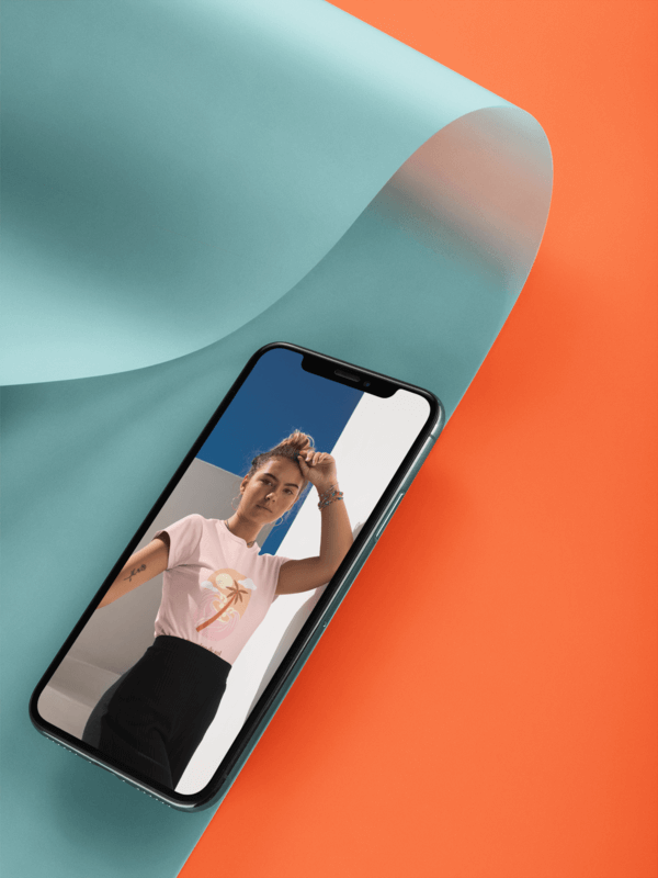 Black Iphone X Mockup Lying On A Bent Semi Transparent Pasteboard