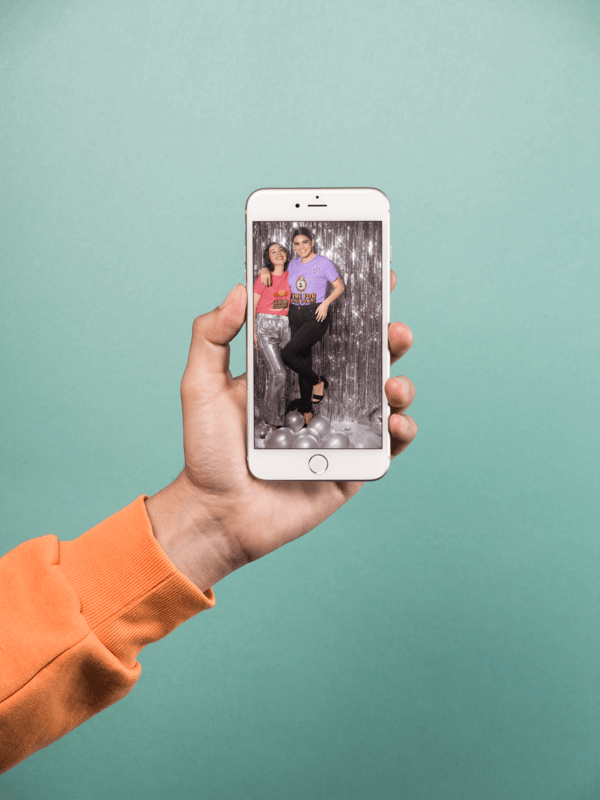 Mockup Of A Hand Holding A Silver Iphone 8 Plus Over A Solid Teal Background