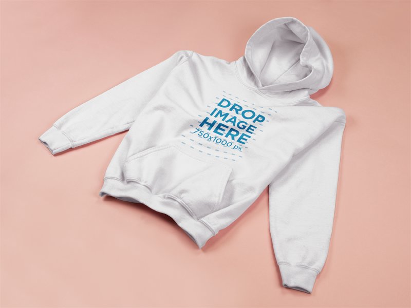 Pullover Hoodie Template Lying on a Flat Pink Surface