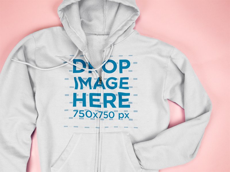 Mockup of a Full Zip Hoodie Hiding a Sleeve Lying on a Pink Surface
