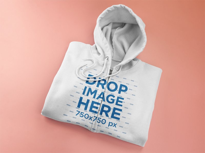 Mockup of a Folded Full Zip Hoodie Lying on a Flat Surface
