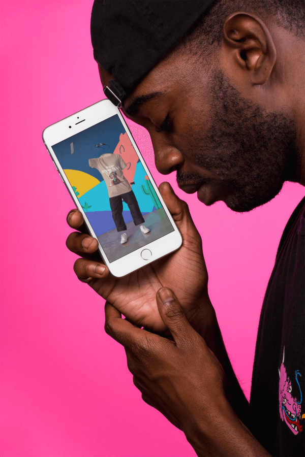 Iphone 8 Plus Mockup Featuring A Man Wearing A Hat Backwards And Leaning His Forehead Into The Iphone