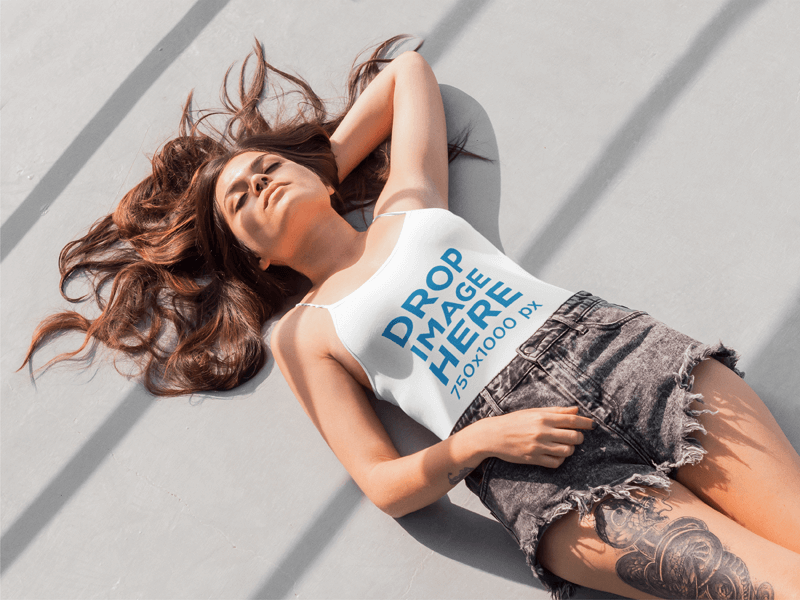 Young Tattooed Woman Lying on the Floor Tank Top Mockup