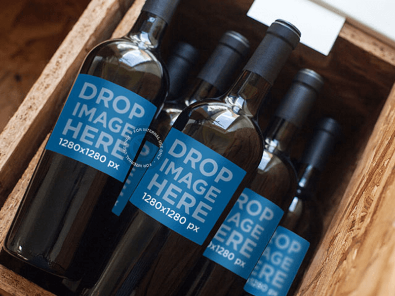 Label Mockup of a Set of Wine Bottles Stacked in a Wooden Container