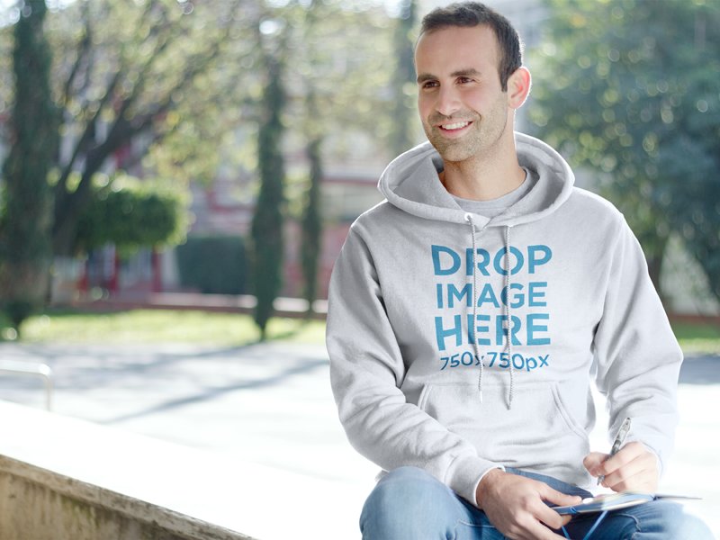 Male Student Sitting on a Bench at School Hoodie Mockup