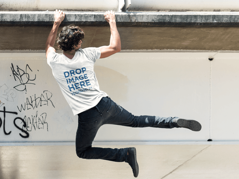 Back Shot of a Man Hanging From a Bridge T-Shirt Mockup