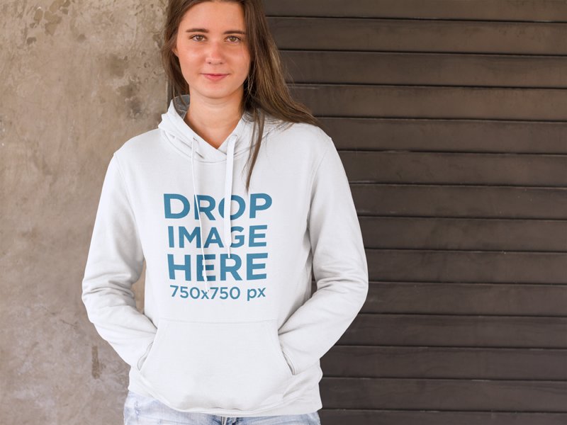 Girl Standing in Front of a Concrete Wall Hoodie Mockup