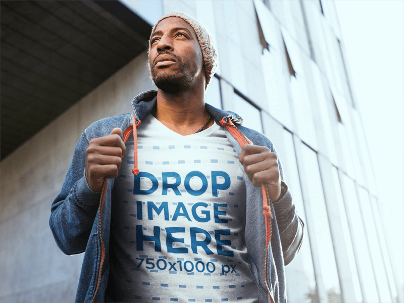 T-SHIRT MOCKUP OF A BLACK MAN WEARING A WINTER OUTFIT