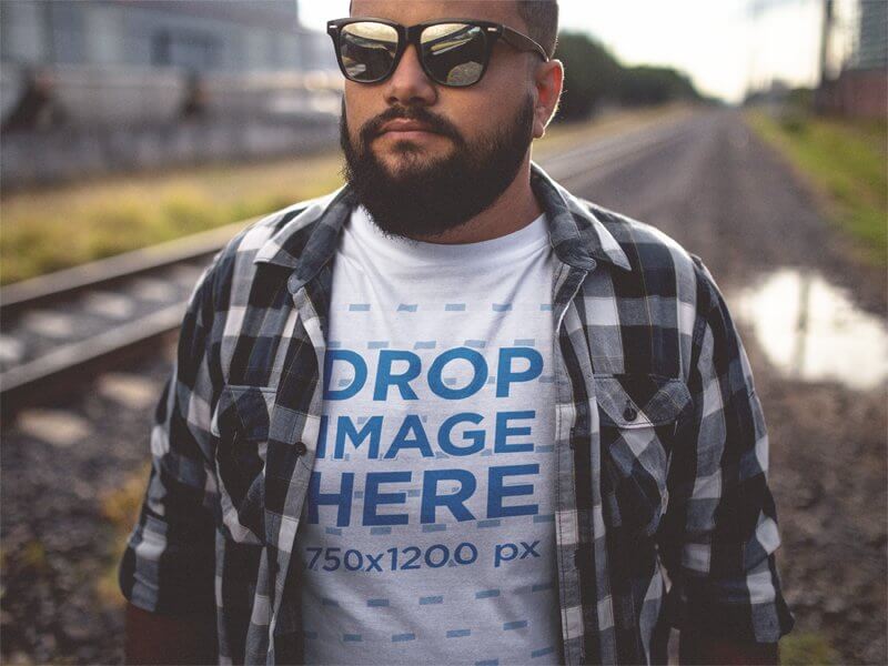 Plus Size T-Shirt Mockup of a Guy Wearing a Plaid Shirt and Sunglasses