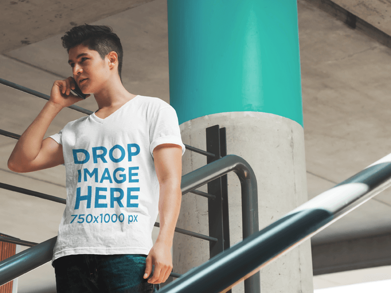 T-Shirt Mockup of a Young Man Talking on the Phone