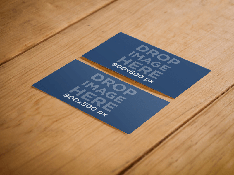 TWO SIDED BUSINESS CARD MOCKUP OVER A WOODEN SURFACE