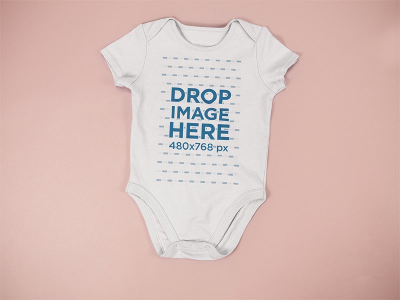 Download Placeit Baby Onesie Mockup Lying On A Flat Surface