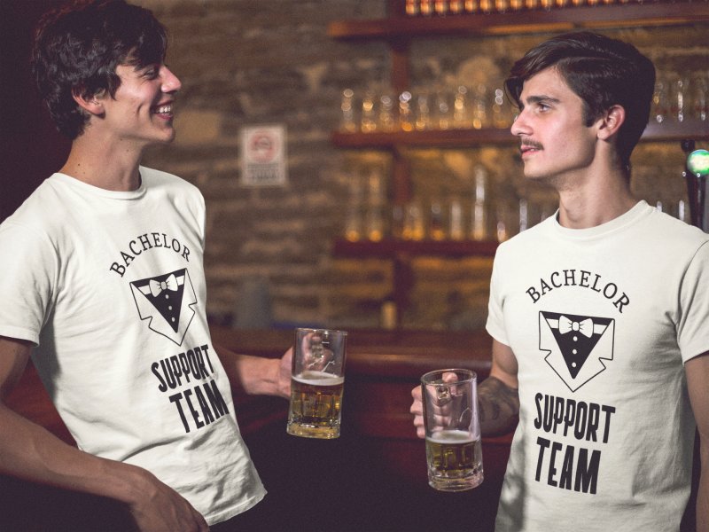 Two dudes having a beer at the bar while wearing different bachelor party tshirts template