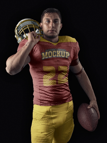 A brunette man posing with a football uniform that can be customized with any sportive design 