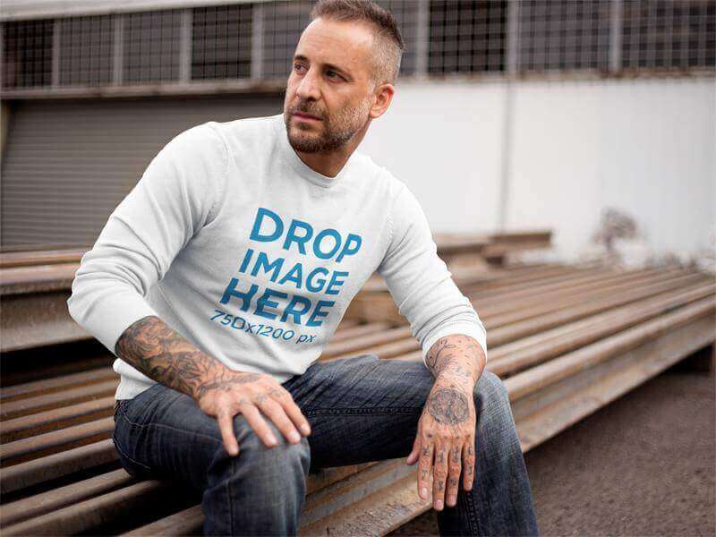 man wearing crewneck outdoors