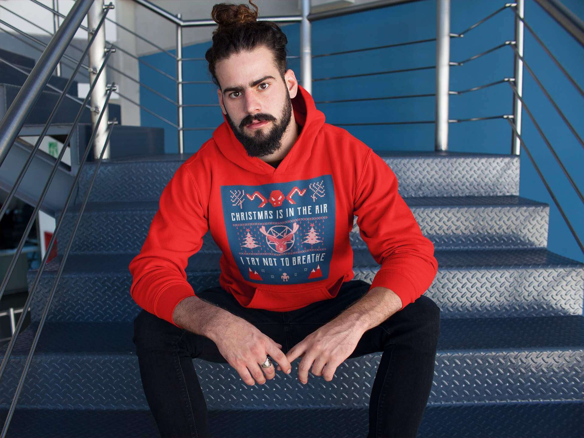 Boy sitting in a Staircase wearing a Ugly Christmas Sweater