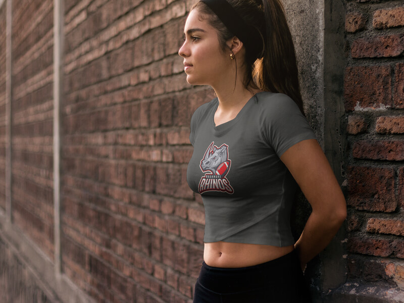 Activewear T Shirt Mockup Featuring Girl Leaning On Brick Wall