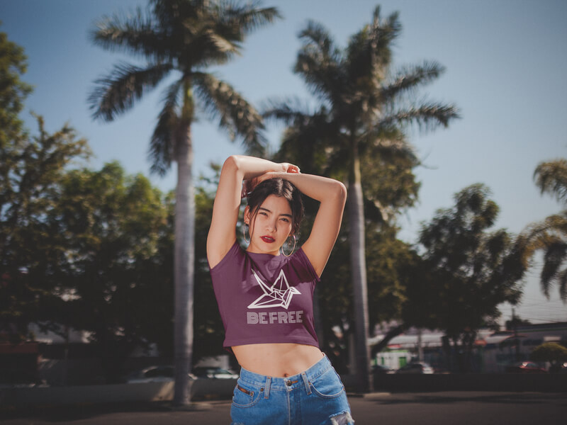 Woman With Arms Up Wearing A Crop Top Tee Mockup On The Street