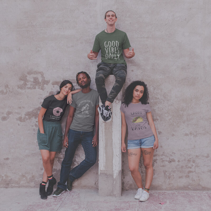 Four Teens Wearing Interracial T Shirts Mockup Against A Concrete Wall