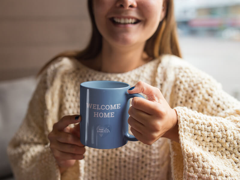 Coffee Cup Mockup of a Woman in Her Home for Real Estate