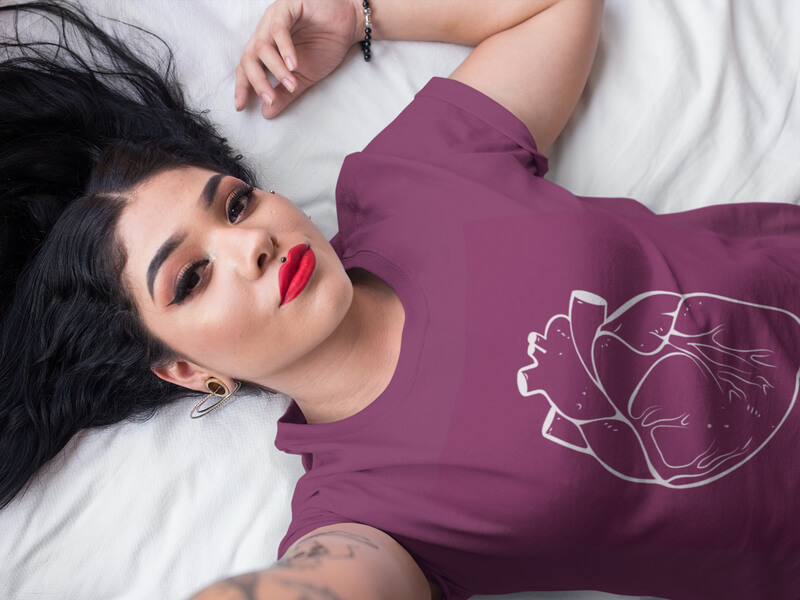 Selfie Of A Girl Wearing A T-Shirt Mockup While Lying in Bed