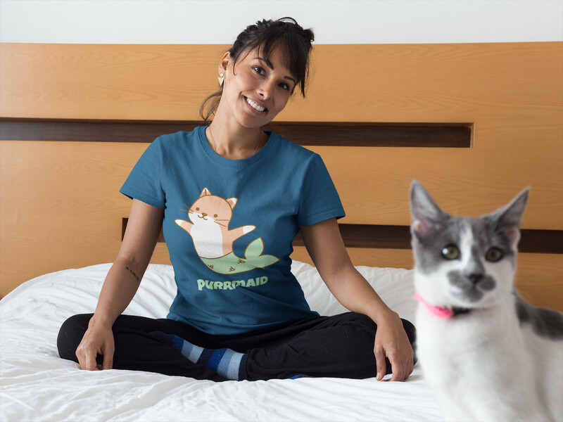 Happy Woman Wearing A T Shirt Mockup On Bed With Her Cat