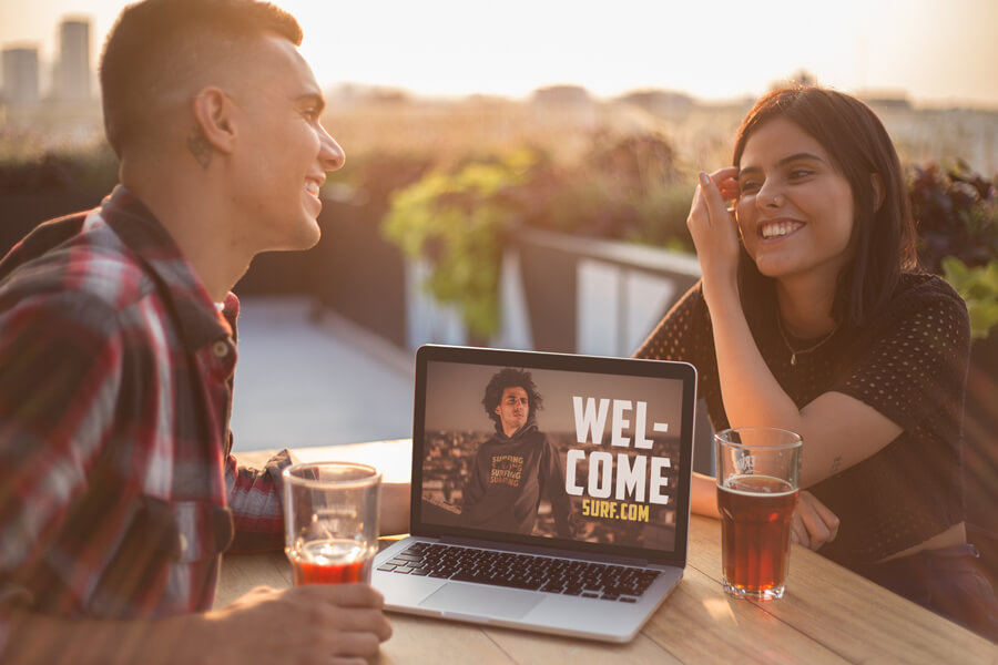 Man And Woman With Macbook Mockup