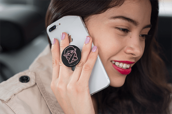 A Women Talking in an iPhone with a Popsocket Mockup