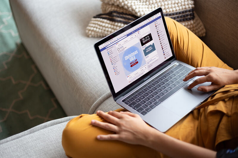 Woman Working With A Macbook Mockup Sitting On A Sofa