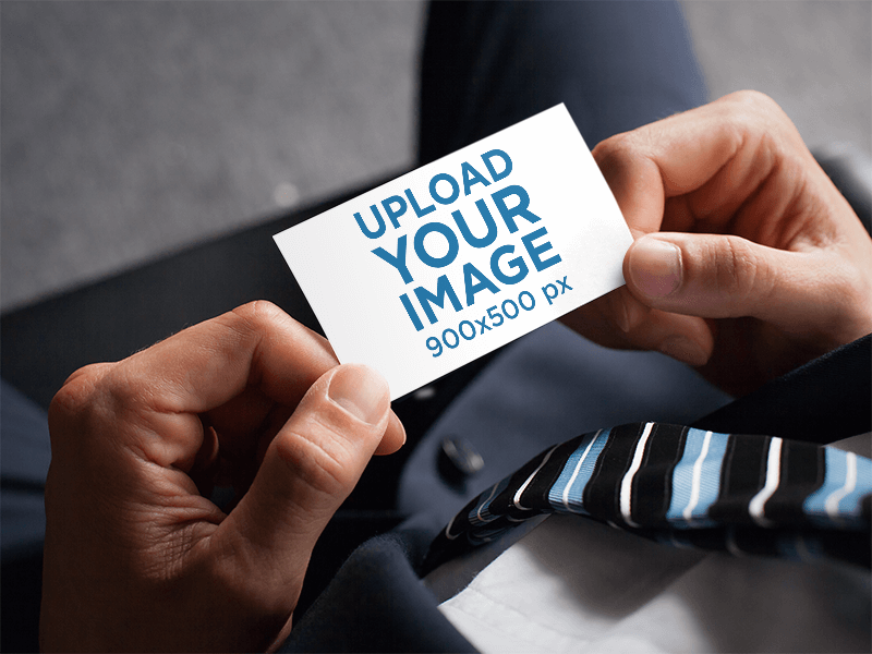 Business Card Mockup Featuring A Businessman Holding A Business Card
