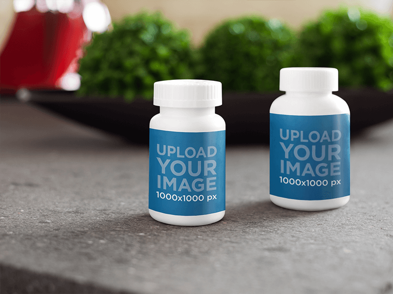 Label Mockup Featuring Two Medical Containers On Top Of A Table