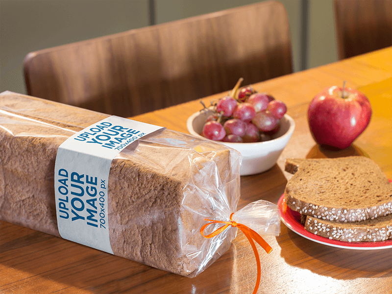 Label Mockup Of A Packaged Loaf Of Bread On Top Of A Table